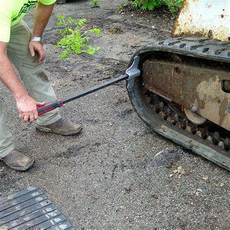 how to install skid steer track|rock removal skid steer tools.